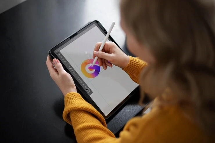 Designer working on typography on iPad