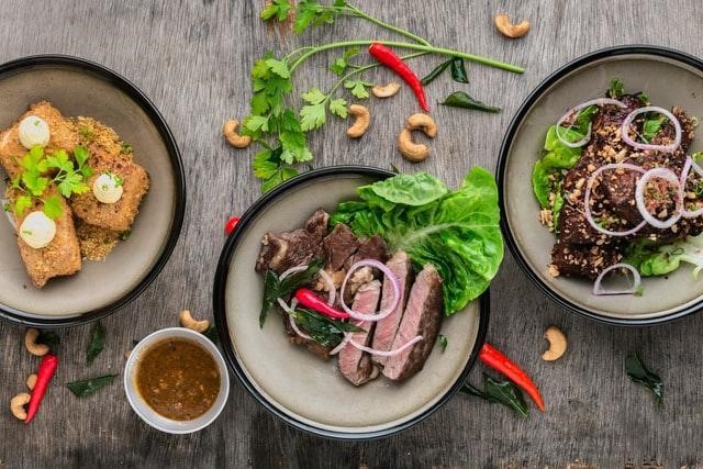 three plates of food steak & fish