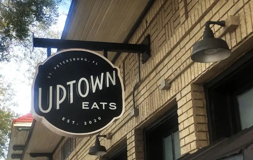 Uptown eats sign