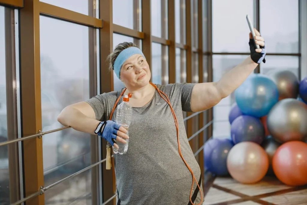Woman taking gym selfie